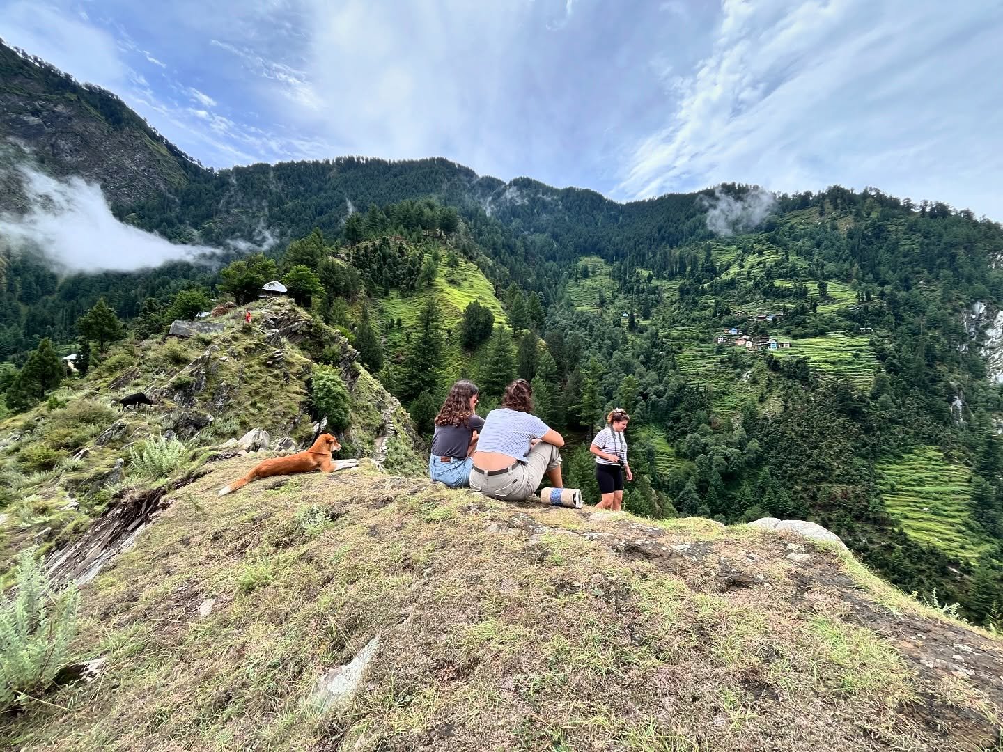 Travellers taking a break during a Himalayan hillside hike