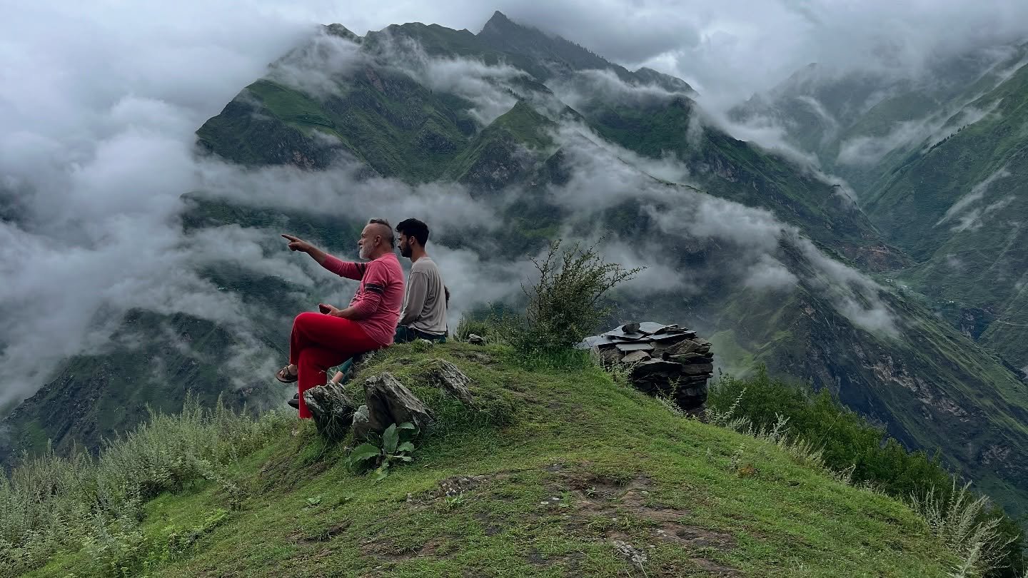 Trekkers on a misty Himalayan ridge